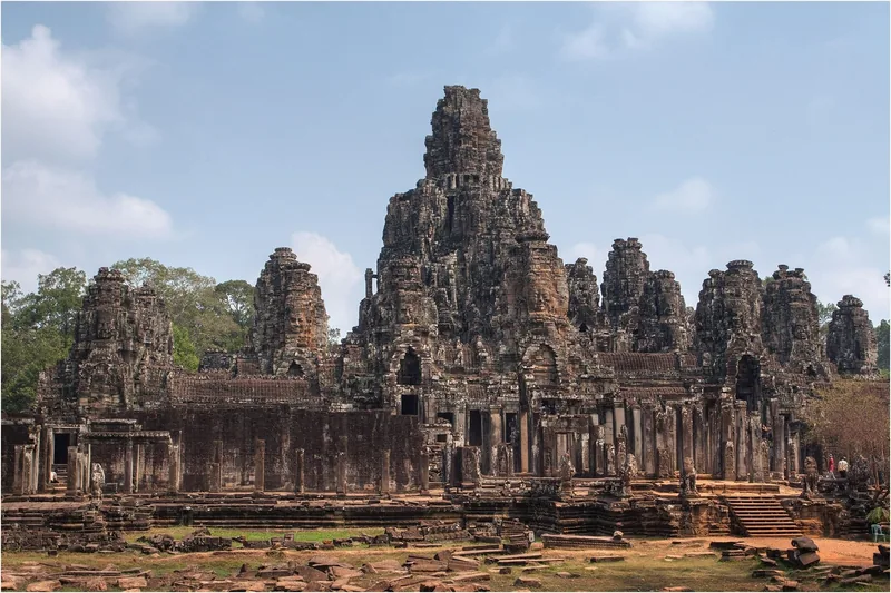 Stone towers with carved faces rise above the ancient Bayon temple in Angkor Thom, Siem Reap.