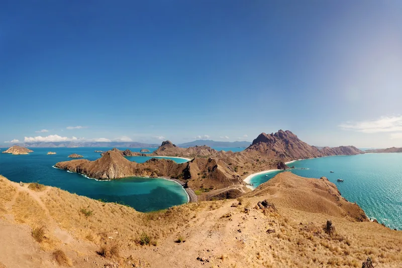 Panoramic view of Padar Island's jagged peaks and turquoise bays near Komodo, Labuan Bajo, Indonesia.